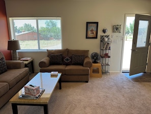 View from bedroom to living room and outside