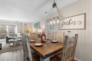 Dine with the family around the large table.