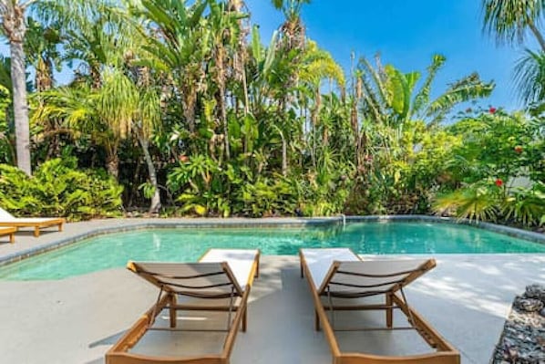 Stunning Heated Pool Surrounded By Tropical Greenery