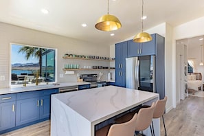 fully-equipped kitchen with a lakeside view.