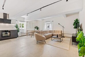 Our living room is perfect for TV enthusiasts, with a large screen. Direct bookings: www.arcaproperties.lu