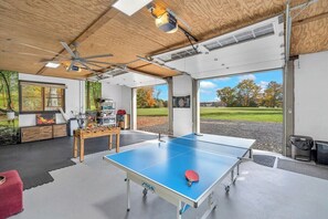Rec Center with ping pong, pop-a-shot, foosball, corn hole,  darts, TV, and more