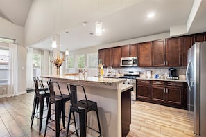 Fully equipped kitchen with high quality granite countertops.