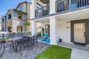 Ground floor patio leading to the beach and bay