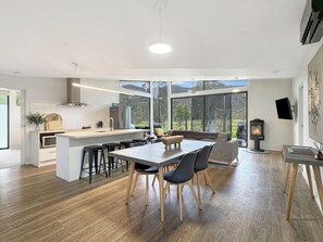 Discover the heart of our home in the well-equipped kitchen and dining area.