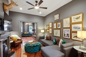 Living room with large sectional couch and TV