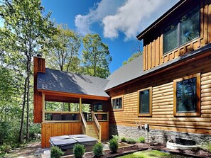 Black Diamond Lodge - Landscaping and Hot Tub in Backyard with Stairs Leading to Covered Deck