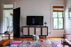Experience the joy of entertainment in our cozy living room w/ a Smart TV.
