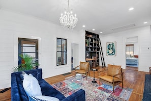 Tall ceilings w/ upgraded light fixtures create a warm & inviting atmosphere.