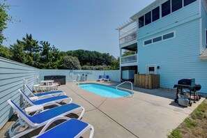 Pool Area - Comfortable poolside loungers, a gas grill and a hot tub create the perfect poolside retreat.