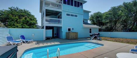 Pool Area - Comfortable poolside loungers, a gas grill, and a hot tub create the perfect poolside retreat.
