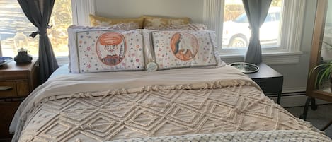 Queen bed with comfortable cotton linens from a trip to India