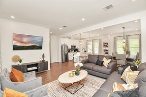 Living room with 1 sofa sleeper located upstairs in Unit B.