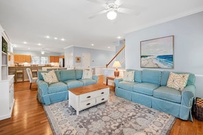 Lots of comfortable seating for your entire group in this bright and open living room.