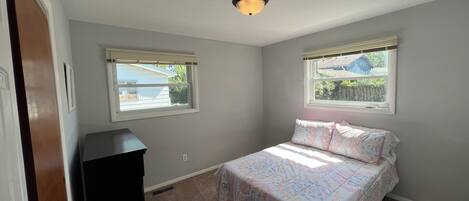 Spacious bedroom with double/full bed, dresser and closet. 