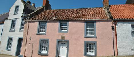 The pretty pink cottage is on the Fife Coastal Path