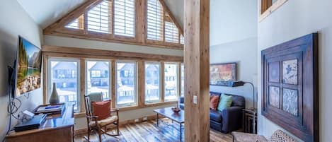 The open floor plan features vaulted ceilings to give an open feel and gives the home a bright airy light.