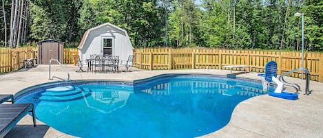 Swim in our vibrant blue pool, complete with a diving board and basketball hoop.