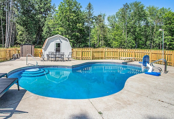 Swim in our vibrant blue pool, complete with a diving board and basketball hoop.