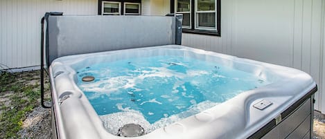 Unwind in our hot tub, the perfect spot to relax after a day of adventures.