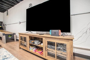 Enjoy gaming on a 65" TV with our Nintendo Switch, a highlight of our game room.