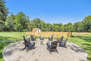 Gather around the fire pit, nestled in four acres of serene landscape.