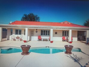 Back of house with several seating areas
