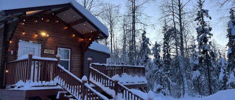 Cozy cabin under a beautiful, winter sky