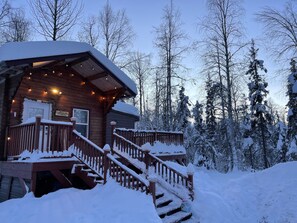 Cozy cabin under a beautiful, winter sky