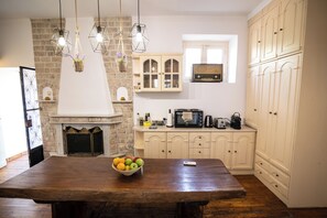 Living room with kitchenette and fireplace!