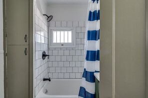 Bathroom with tub and shower