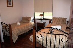 Two single beds.  All chalets are identical with different colour schemes.