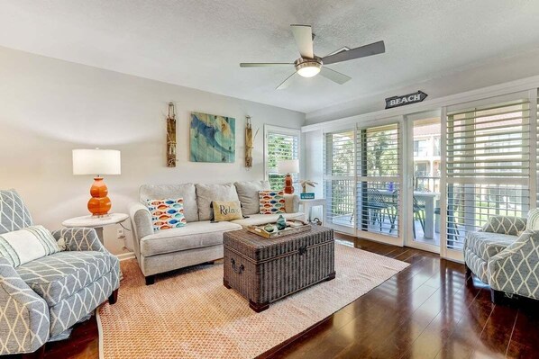 Come unwind with us in this colorful living room space. Spend some time on the patio making endless memories with your friends and family.