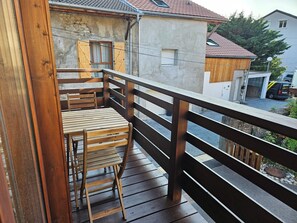 Enjoy the evening breeze on the outdoor balcony.