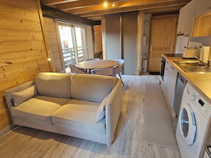 The kitchen and living space includes a sofa-bed and dining for 4 people.