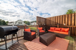 Deck with seating and charcoal grill