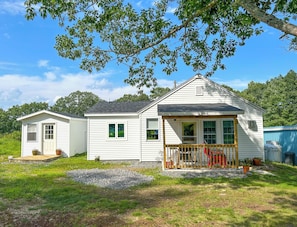 Exterior of the main house and detached bunkhouse to the left. 