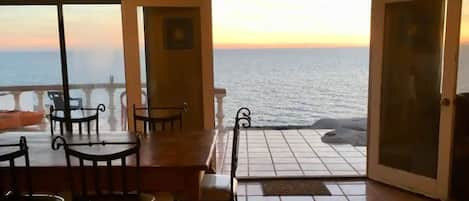 Living/Dining room/Patio looking out to the ocean