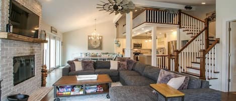 Comfortable open floor plan of living room, dining room, kitchen, and loft!