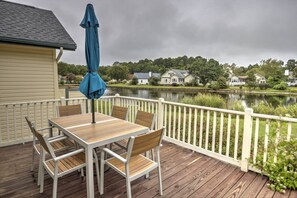 Great outdoor deck with a view of the pond.