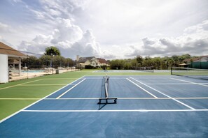 Tennis and pickleball courts available for play.