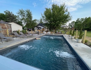 4 locations of benches in pool with spa jets!