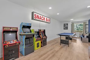 Game room with arcade games and pool table