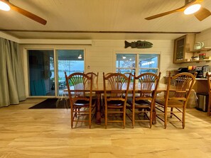 Lake-facing dining area with seating for 8
