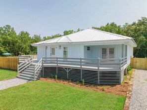 Southern charm and wrap around deck invite you to sit and sip a drink outside.