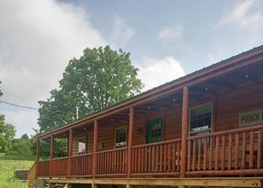 The spacious deck wraps around the cabin offering beautiful valley views 