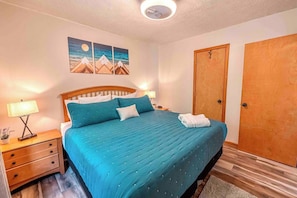 Stay in bed a little longer! A downstairs bedroom designed for true rest - soft light, cool air, and total tranquility on the king-sized bed.
