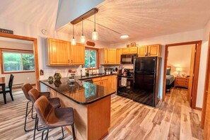 An open space designed for slow mornings and heartfelt conversations. Equipped with modern appliances, and kitchen staples to make simple, heartwarming meals right at home