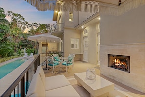 You can settle in on the back patio for a tranquil evening around the fireplace on cooler FL nights.