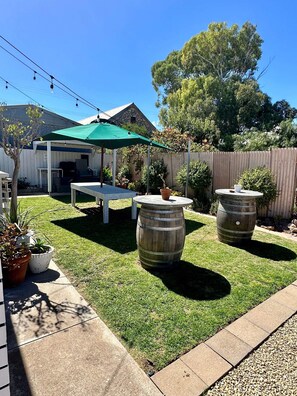 Unit 3 BBQ area including large table to entertain the crew.